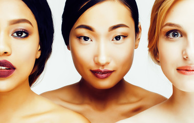 three different nation woman: asian, african-american, caucasian together isolated on white...