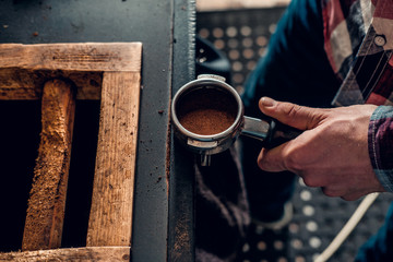 Fototapeta na wymiar Close up image of a man making coffee.