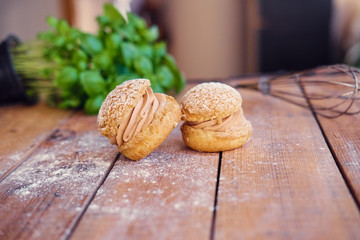 Baked sweet cakes on a wooden table.