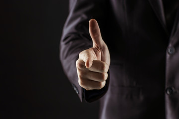 concept of success in business:businessman pointing his finger forward