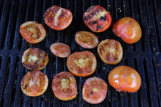 Fresh Red Tomatoes On A BBQ With Grill Marks