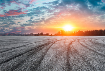 Asphalt road and beautiful sky at sunset