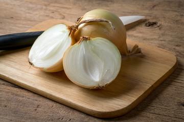 Onion on brown wood