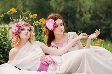 Beautiful bridesmaid lie in nature.