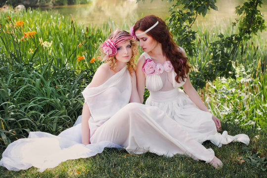 Beautiful bridesmaid in a retro style sitting in nature.