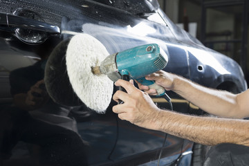 Auto body repair series : Closeup of polishing black car paint