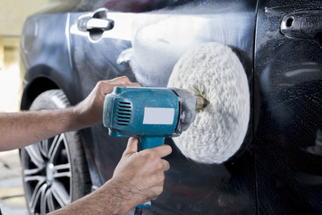 Auto body repair series : Closeup of polishing black car paint