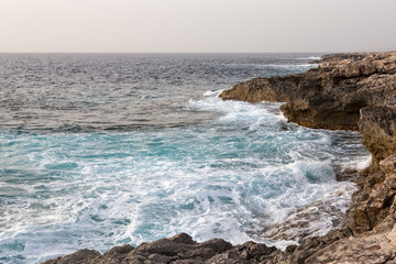 Fototapeta na wymiar Waves sea cliffs cyprus