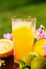 Orange juice, flowers and fruits 