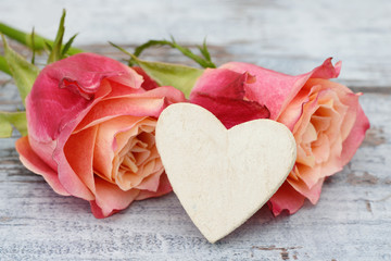 roses with white heart on wood