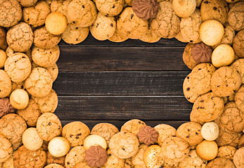 Cookies and biscuits at brown wood with copy space
