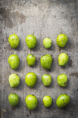 Some mango on a table in a geometrical order.