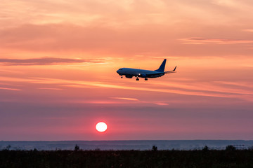 Aircraft landing at sunrise