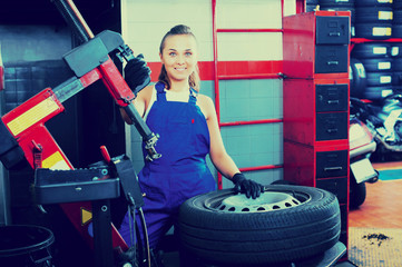 Mechanic working on car wheel