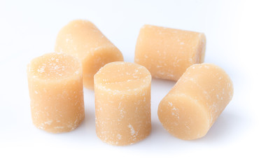 Coconut sugar over white background