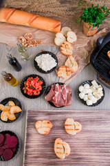 Ingredient for bruschetta on wooden background. Top view
