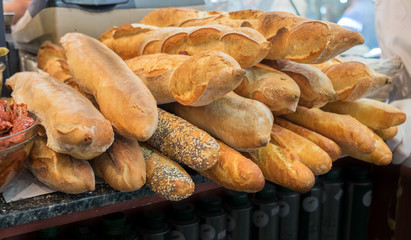 Baguette - long, thin loaf of French bread, for sale at Mahane Yehuda Market, popular marketplace in Jerusalem, Israel