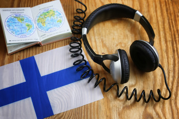 course language headphone and flag on a table © alexkich