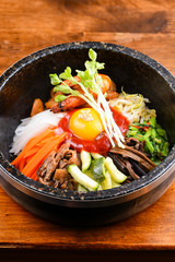 Bowl of bibimbap on the wooden table