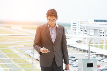 indian male walking at airport
