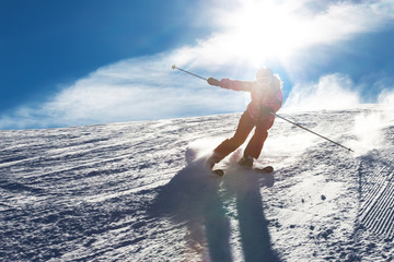 The girl quickly descends on alpine skiing
