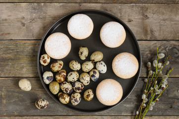 Quail eggs with muffins on the plate