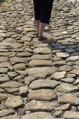 The person walking on stones Roman road