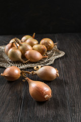 Fresh bulb onions  on the table. 