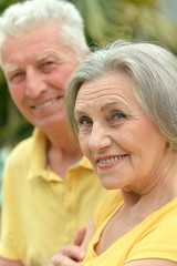 Happy elderly couple embracing