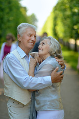 Happy elderly couple embracing