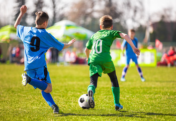 Football soccer match. Running soccer player. Training and game for children. Youth soccer league.
