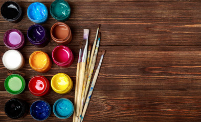 Art and craft tools.Artist's brush, canvas. Wooden art palette with tubes of acrylic...