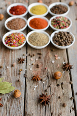 Various spices on wooden spoons. Food ingredients
