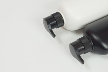 Black and white plastic bottle White background. Flask. Isolated.
