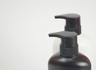 Black and white plastic bottle White background. Flask. Isolated.
