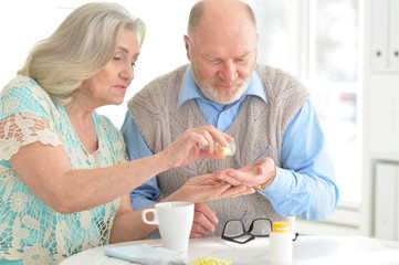 Elderly couple with pills