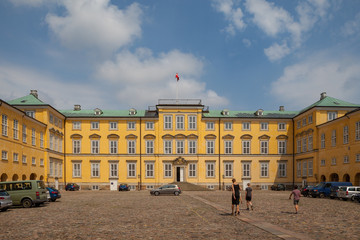 Fototapeta na wymiar COPENHAGEN, DENMARK - 25 JUN 2016: Frederiksberg palace facade and walking people