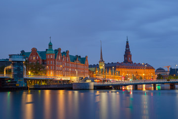 Night view on Christiansborg Palace and Slotsholmen over the canal in Copenhagen, Denmark.