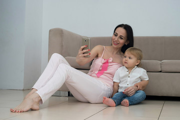Fototapeta na wymiar Mother and baby taking selfie
