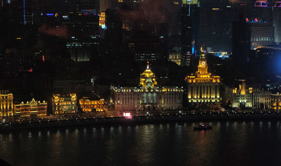 Fototapeta na wymiar Night view to the riverside business center in Shanghai, China