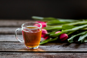 tea and milk on old wood background