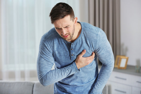 Man having a heart attack at home