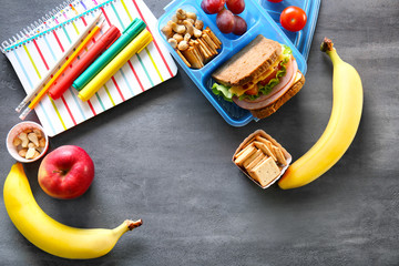 School lunch and stationery on table