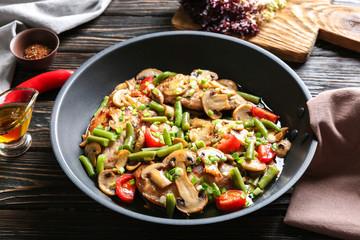 Tasty chicken marsala on pan on table