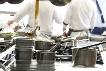 Chef in the kitchen in the restaurant
