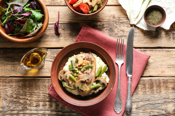 Tasty chicken marsala with vegetables on table