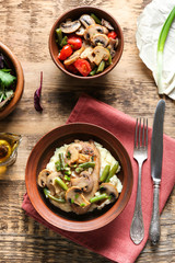 Tasty chicken marsala with vegetables on table