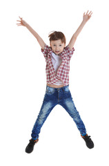 Cute boy jumping on white background