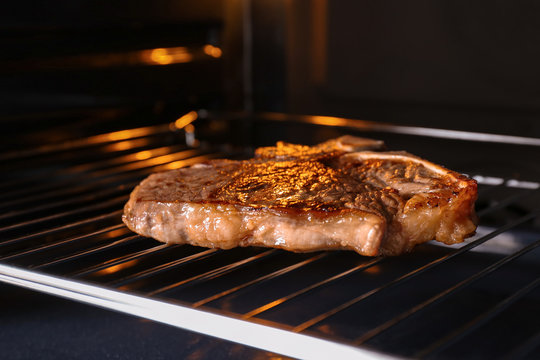 Tasty grilled steak in oven