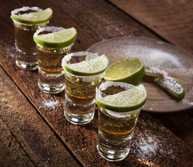 Tequila shots on wooden background